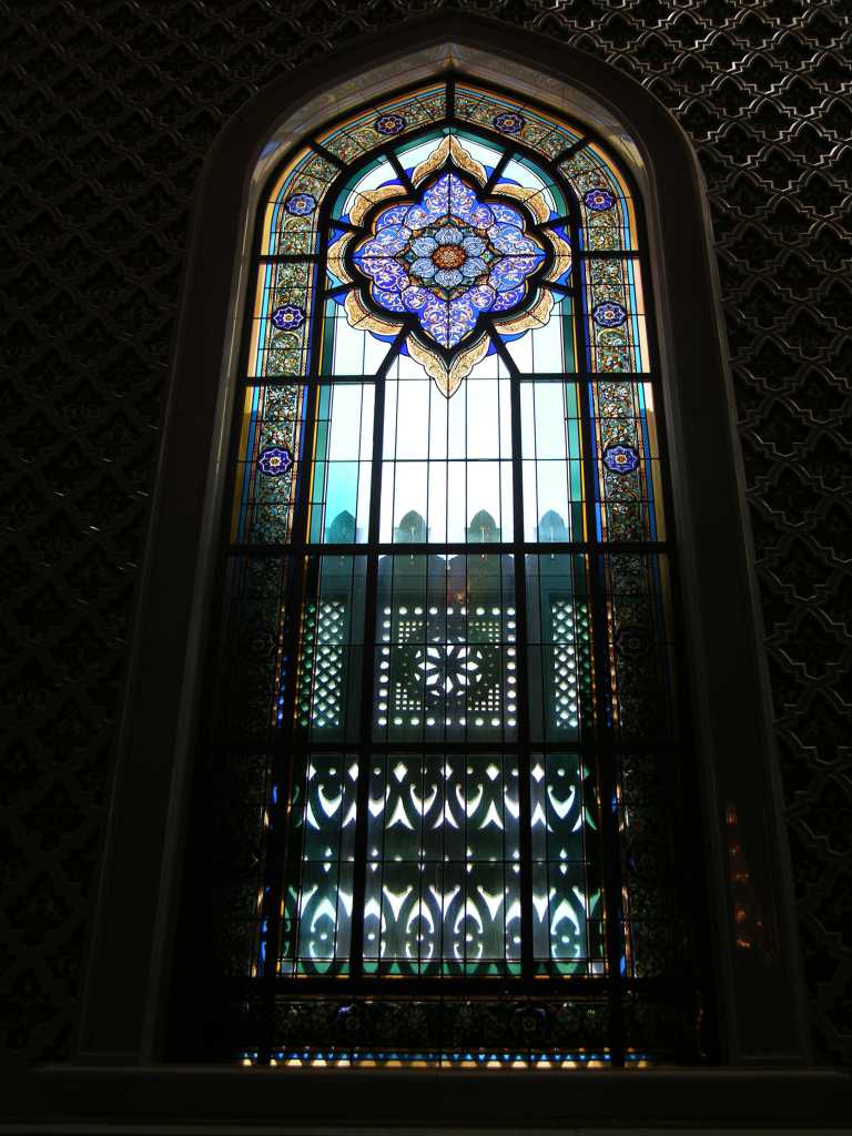 Muscat 04 Grand Mosque 10 Colourful Stained Glass Window The main prayer hall is set with stained glass windows with geometric designs and pictures of plants.